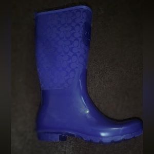 A pair of coach high top boot.